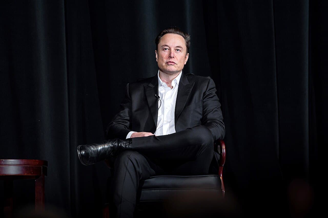 Elon Musk seated on stage at the U.S. Air Force Academy in April 2022.